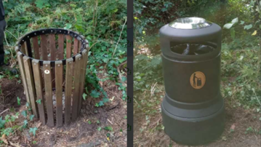 small wooden bin on left, new replacement larger black bin with covered lid on right