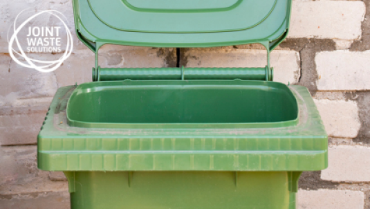 Green wheelie bin with Joint Waste Solutions logo top left