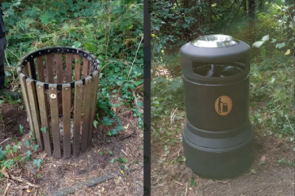 small wooden bin on left, new replacement larger black bin with covered lid on right