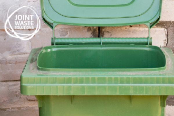 Green wheelie bin with Joint Waste Solutions logo top left