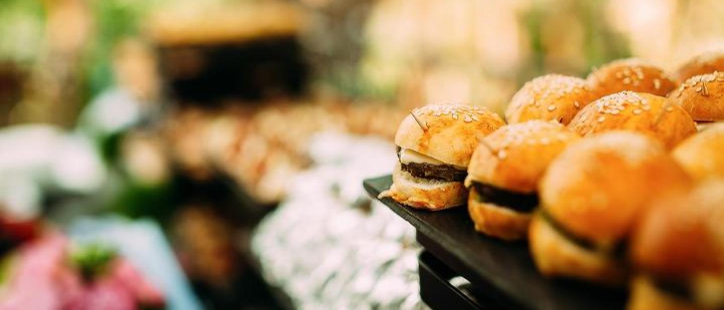Mini burgers and food on a table