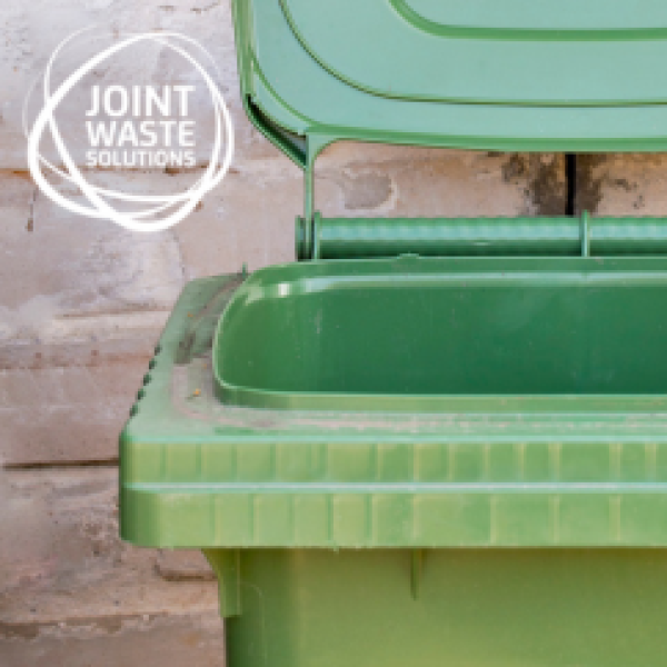 Green wheelie bin with Joint Waste Solutions logo top left