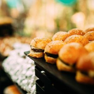Mini burgers and food on a table